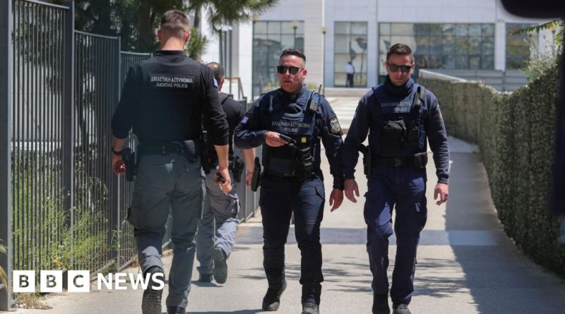 A serious business meeting discussing the Athens shooting suspect.