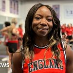 Adaptive cheerleading team showcasing teamwork and skills in a competition setting.