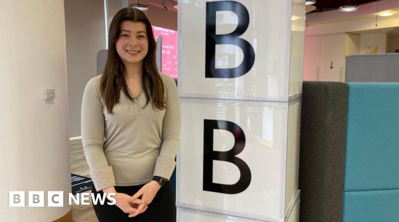 A diverse group of women discussing endometriosis awareness in a professional setting.