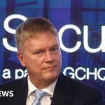 Professionals discussing AI cyber tools in a business meeting setting.