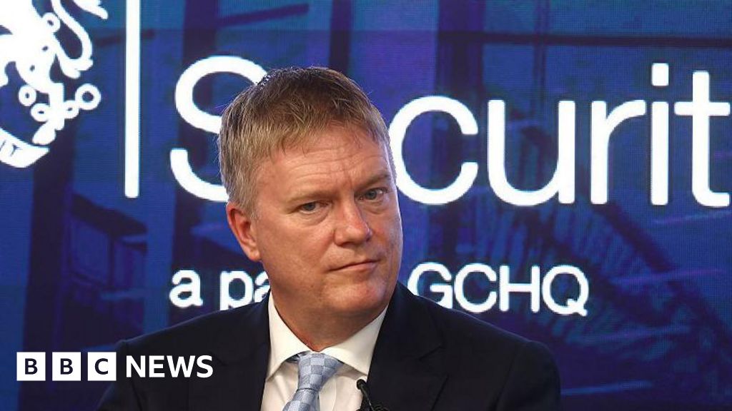 Professionals discussing AI cyber tools in a business meeting setting.