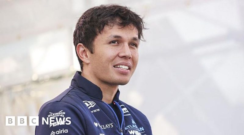 Alex Albon preparing for the Miami Grand Prix, surrounded by a lively atmosphere.