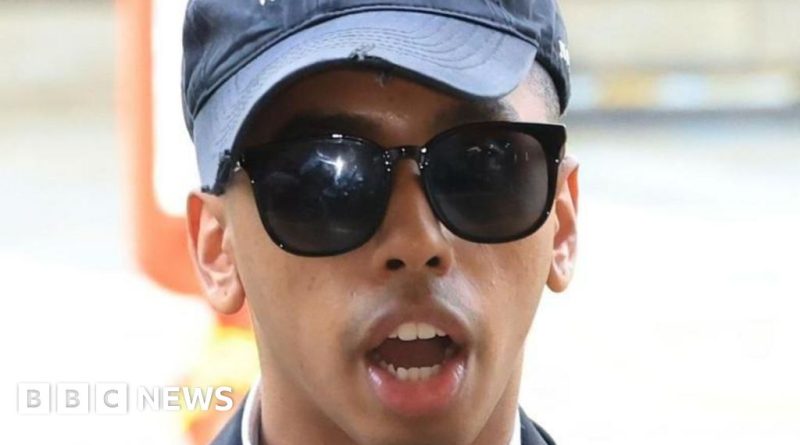 A public gathering discussing the cultural significance of a memorial statue.