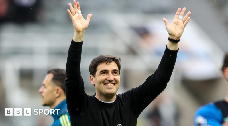 Soccer players celebrating a victory, showcasing teamwork and joy after a match, related to Andoni Iraola departure.