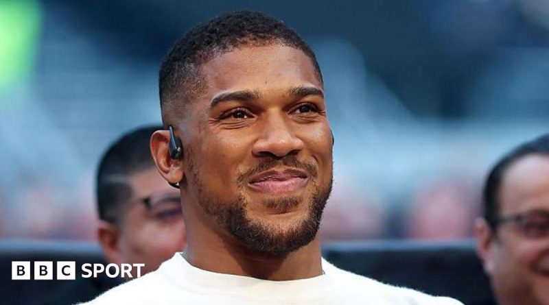 Anthony Joshua's comeback fight in a boxing ring with intense action.