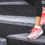 Professionals discussing daily health guidelines in an office setting.