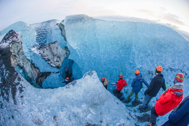 Professionals discussing Argentina glacier mining law with glaciers in background.