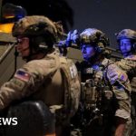 Security personnel oversee the press dinner shooting incident involving the press dinner shooting suspect.