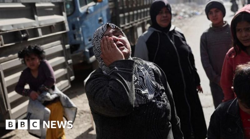 Professionals discussing the arrest of a Tadamon massacre suspect in a serious setting.