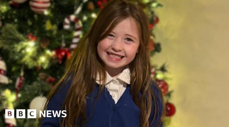 Police officers investigate the scene of a young girl's tragic death.