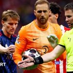 Tense moment during a football match showcasing Arsenal refereeing frustration.