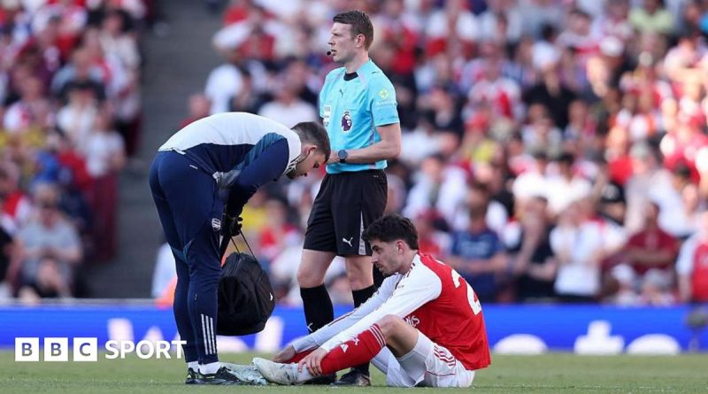 Professional football players strategizing for the Arsenal title challenge.