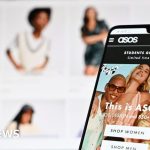 Professionals discussing Asos tariff refunds in a modern office.