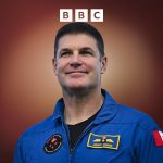 Astronauts discussing the Artemis II mission in a space center.