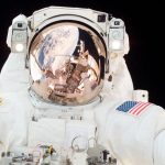 Astronauts performing exercises to prevent back pain in space.