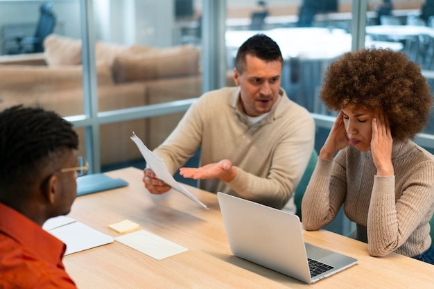 People discussing subscription traps in a professional office setting.