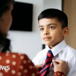 Professionals discussing PFAS chemicals ban in a bright office setting.