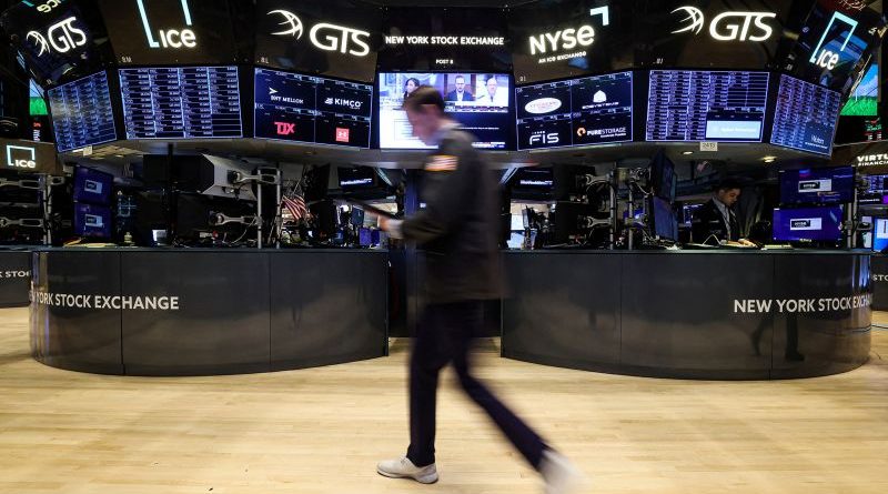 Professionals discussing bank earnings in a modern office setting.