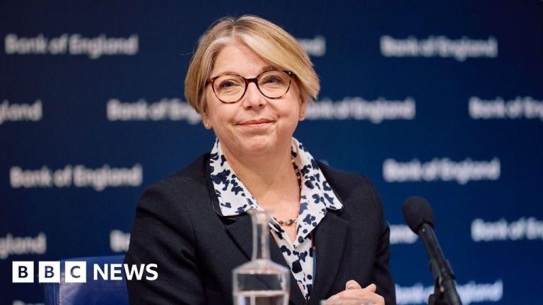 Professionals in business attire discussing the Bank of England stock market warning.