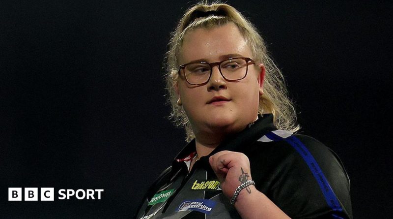 Beau Greaves PDC champion in action during a competitive darts match.