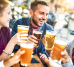 Professionals discussing beer health benefits in a modern office setting.