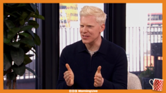 A diverse group of professionals using heart rate trackers while exercising outdoors.