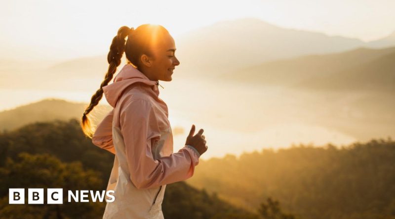 Diverse group exercising outdoors, highlighting body clock exercise timing.