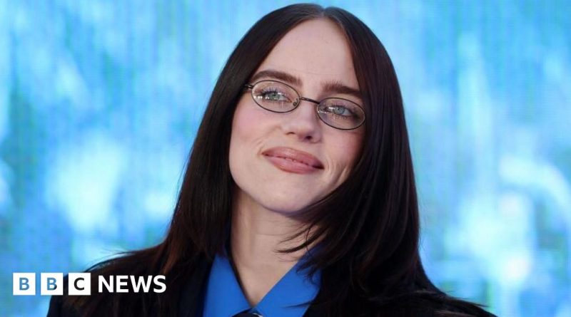 A lively concert scene showcasing Billie Eilish's concert film atmosphere with diverse audience and bright lights.