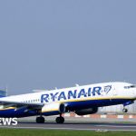 Travelers at airport border control facing flight delays in Europe.