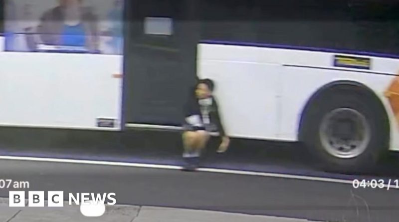 A boy trapped on a bus is safely rescued with help from bystanders.