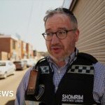 A diverse group discussing safety measures in the Golders Green incident.