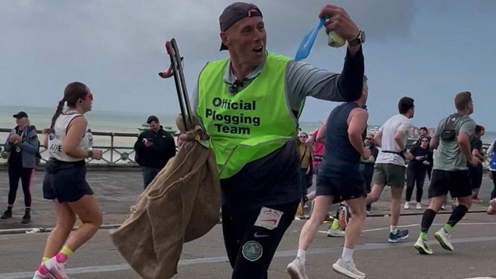 Runners participating in the Brighton Marathon plogging event while collecting litter.