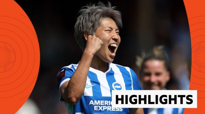 Brighton and Manchester City players compete in an intense WSL match.