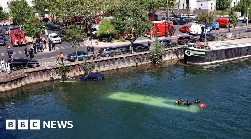 Emergency responders assess a bus accident near the River Seine.