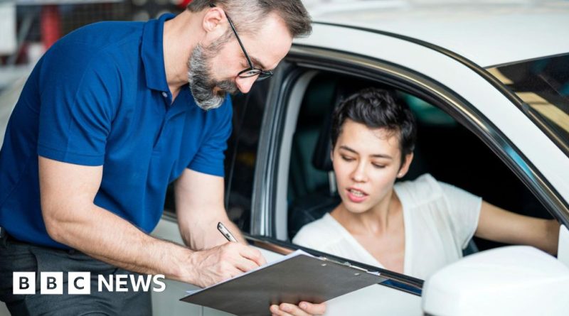 A diverse professional group discussing car finance compensation payments.