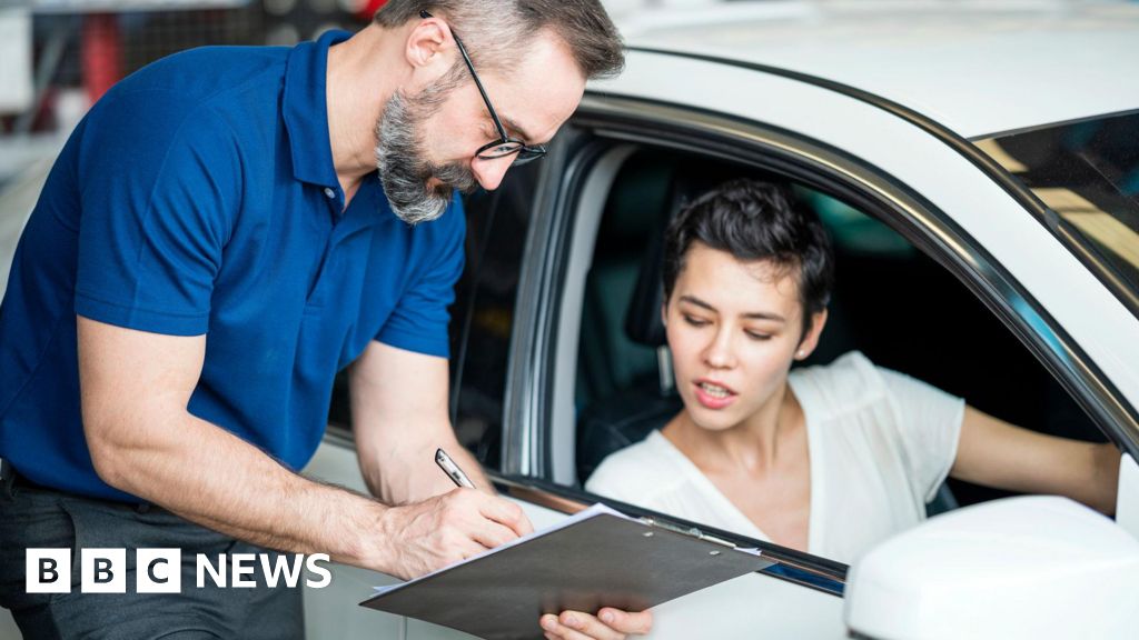 A diverse professional group discussing car finance compensation payments.