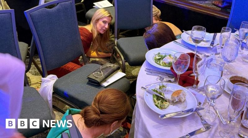 Attendees at the correspondents' dinner seeking safety during gunshots.