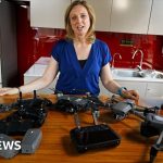 Professionals discussing the drone sales ban in Beijing's modern office.