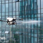 People in professional attire operating drones in Beijing under new regulations.