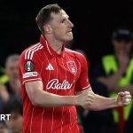 Chris Wood Nottingham Forest players practicing together on the field.