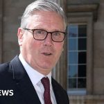 Civil service changes prompt discussions among professionals in a modern office.