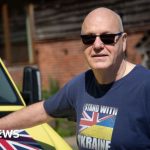 A diverse group of professionals discussing a ventilator donation controversy.