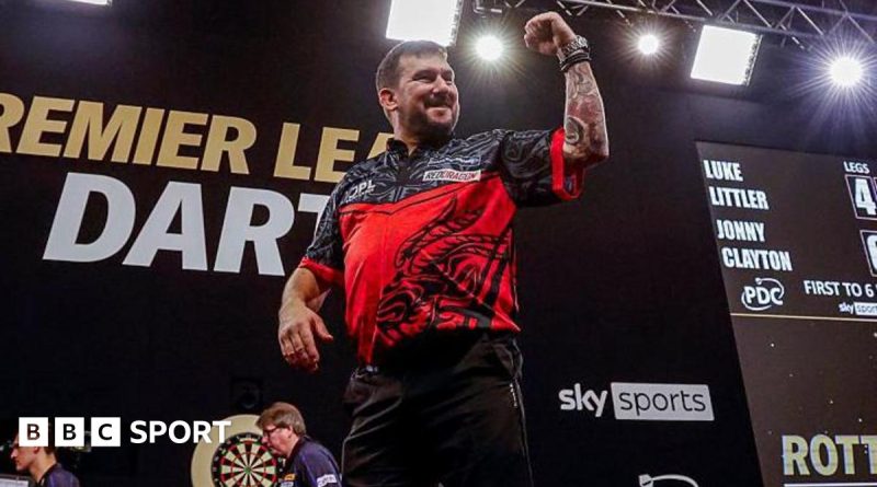 Jonny Clayton demonstrating his skills in the Premier League darts competition.