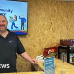 Customers at Woking Community Grocery finding affordable food options.