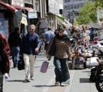 Crowded market in Iran showing economic struggles and daily life.