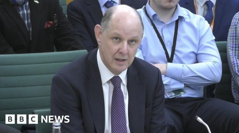 Group of professionals discussing concerns about Mandelson Epstein ties in an office.