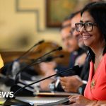 A serious discussion on Venezuela political prisoners in a business setting.