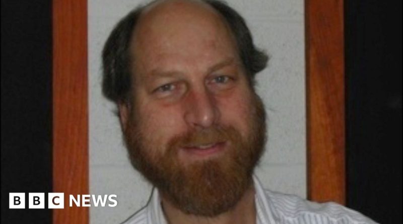 A group of scientists engaged in a serious discussion about research related to missing scientists.