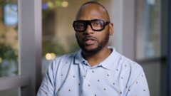 Professionals discussing workplace culture issues at Pride in London.