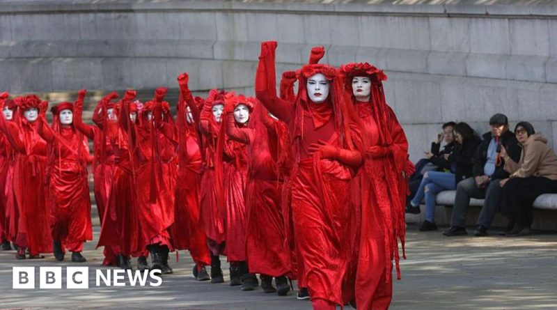 A diverse group of officials discussing ending fossil fuels at a climate conference.